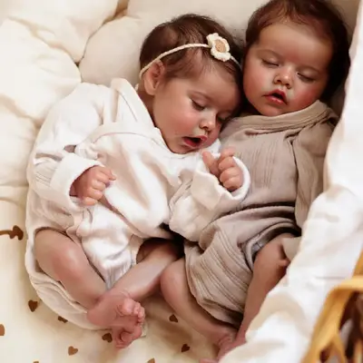 17" Soft Vinyl Twin Newborns With Brown Hair and Closed Eyes Featuring a Sleeping